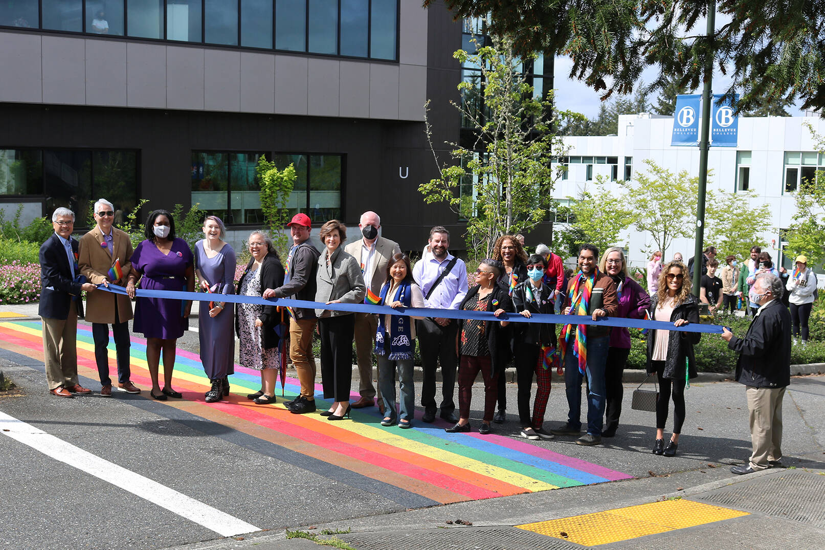 Ribbon cutting ceremony for the first Pride flag crosswalk at Bellevue College on May 17. Courtesy of Bellevue College.