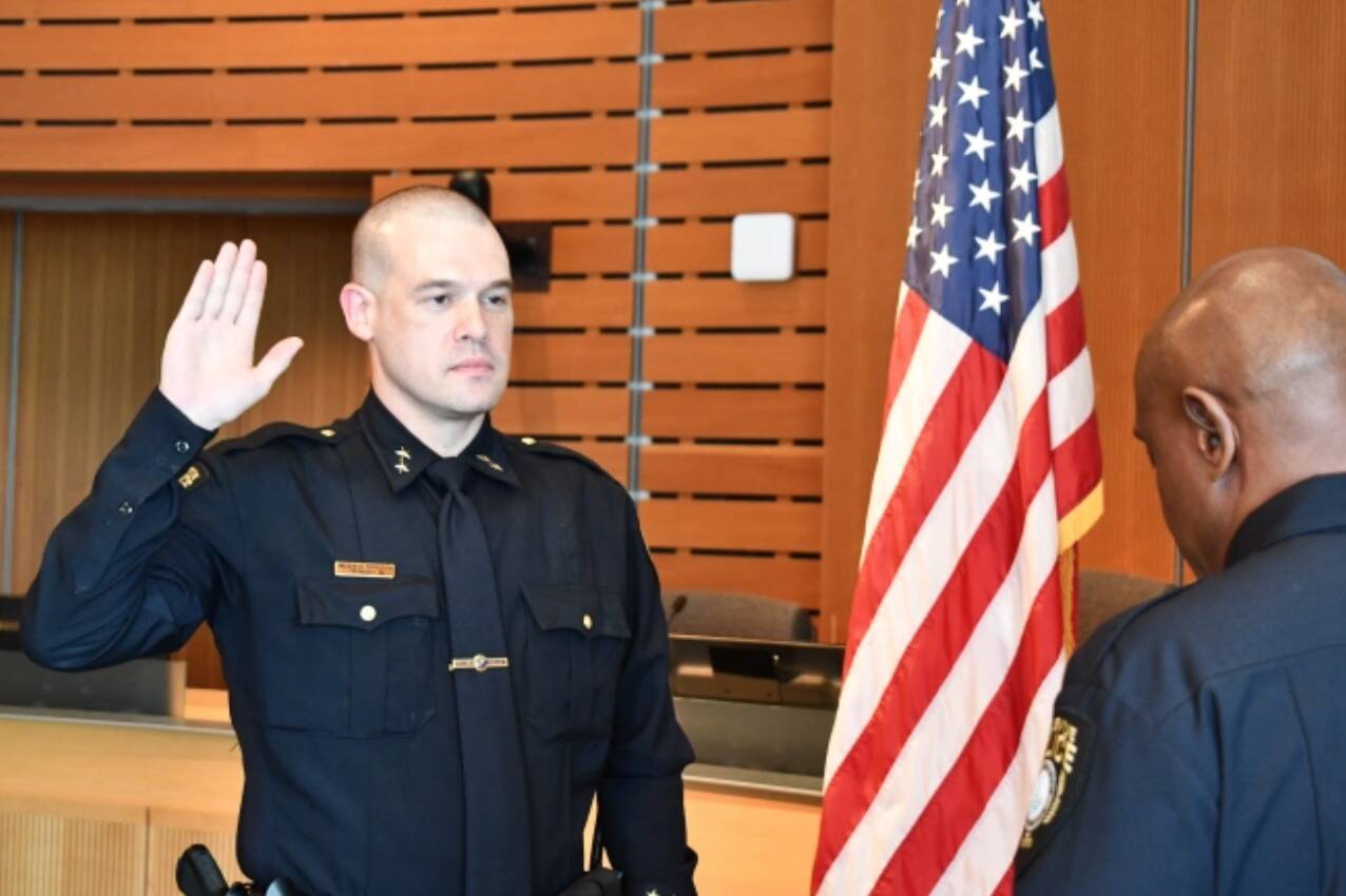 Andrew Popochock sworn in by Chief Shirley (Screenshot from Bellevue Police Department website)