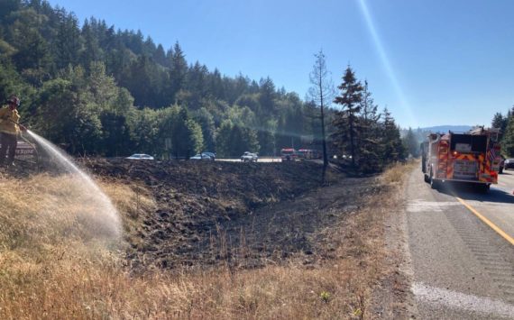 Eastside Fire and Rescue responds to a large brush fire July 25 on Interstate 90 near High Point Way east of Issaquah. Courtesy photo