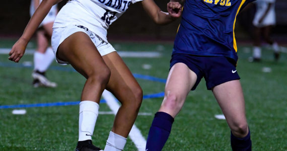 Bellevue sophomore Kendall Gillem (#10) attempts to take the ball away from Interlake's Sonia Devaraju (#13). Courtesy of Ste