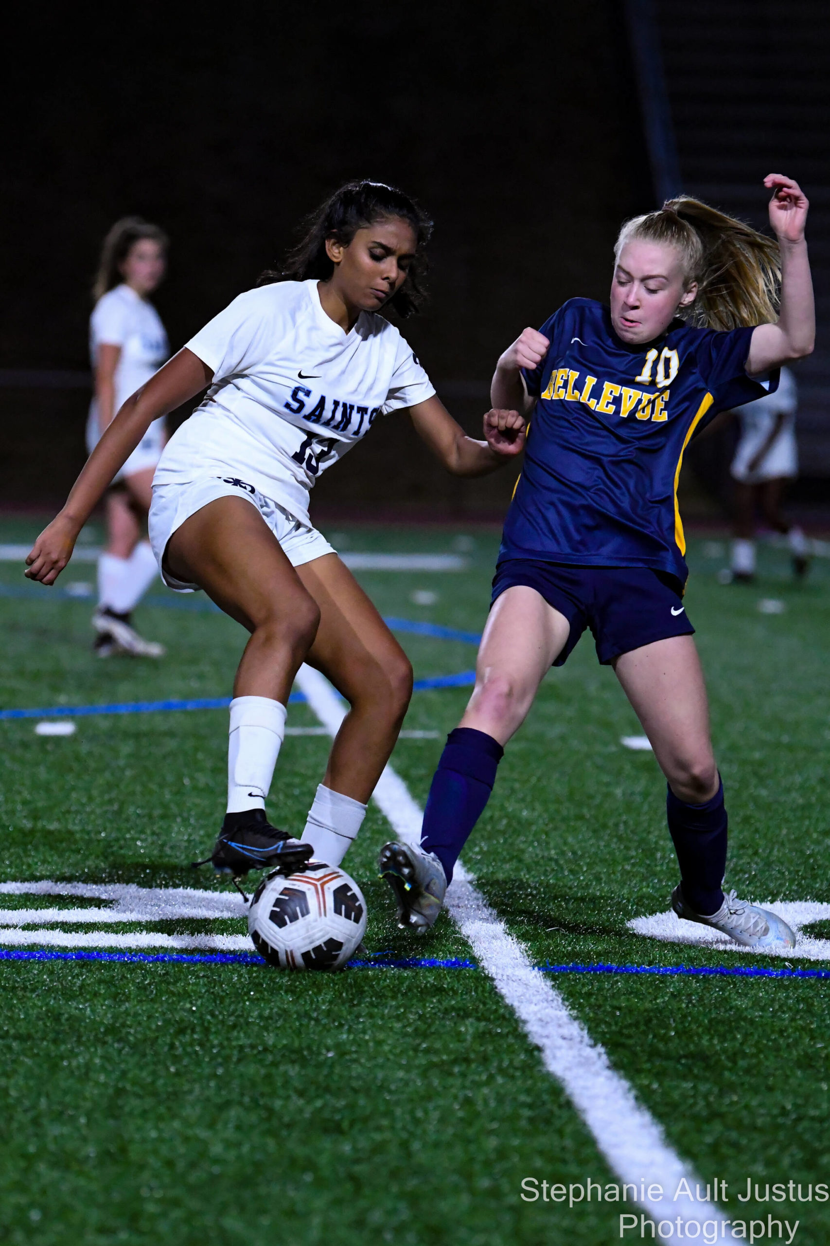 Bellevue sophomore Kendall Gillem (#10) attempts to take the ball away from Interlake's Sonia Devaraju (#13). Courtesy of Ste