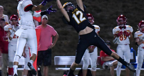 Bellevue High School’s sophomore, Bryce Smith (#12), intercepts the football from Newport junior Matthew Lee (#2). Courtesy of Stephanie Ault Justus.