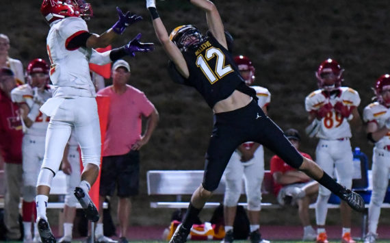 Bellevue High School’s sophomore, Bryce Smith (#12), intercepts the football from Newport junior Matthew Lee (#2). Courtesy of Stephanie Ault Justus.