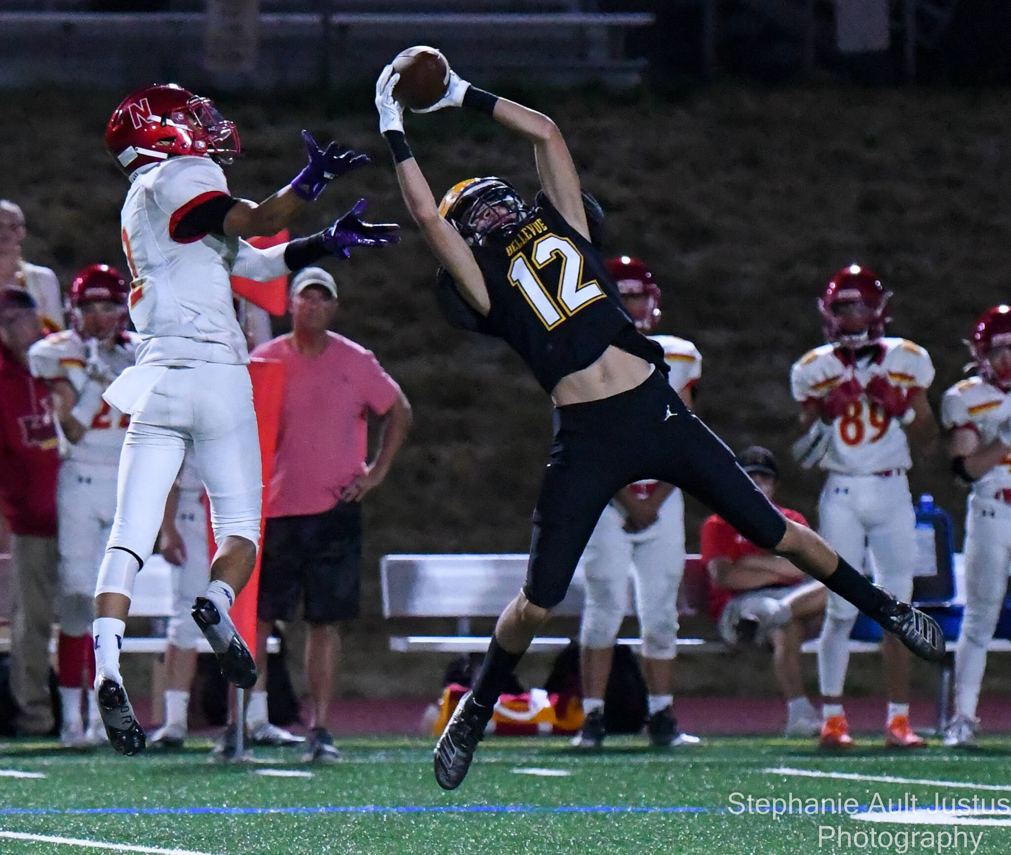 Bellevue High School’s sophomore, Bryce Smith (#12), intercepts the football from Newport junior Matthew Lee (#2). Courtesy of Stephanie Ault Justus.