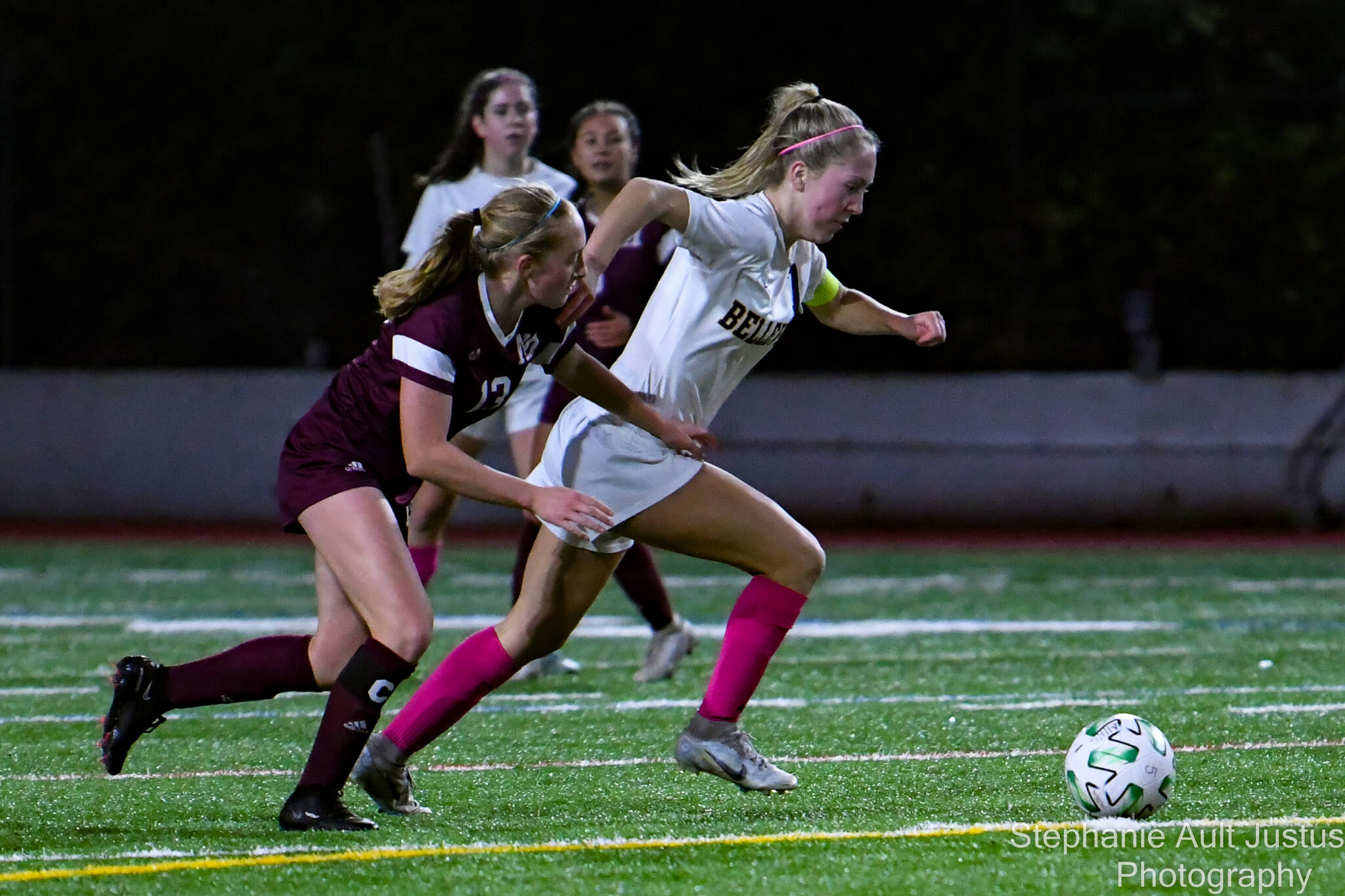 Bellevue High School’s captain Gabi Bede (#7) dribbles the soccer ball past Mercer Island opponent Mia Shanafelt (#13). Courtesy of Stephanie Ault Justus.