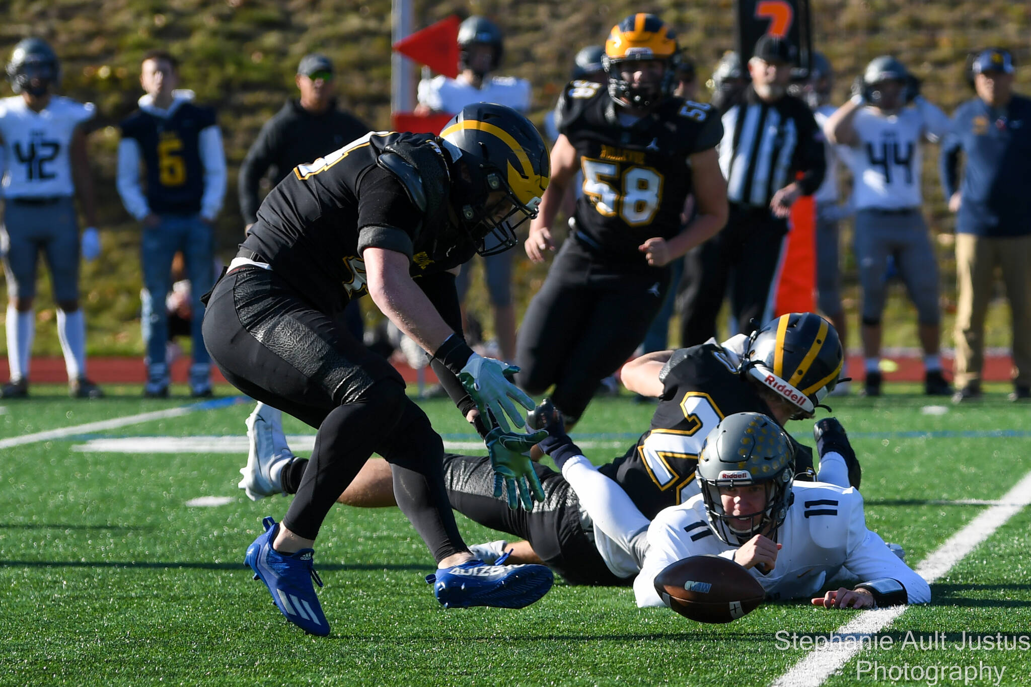 Bellevue junior Tate Hauser (#20) tackles Mead’s quarterback, Colby Danielson (#11), who fumbles the ball. November 12, 2022. Courtesy of Stephanie Ault Justus.