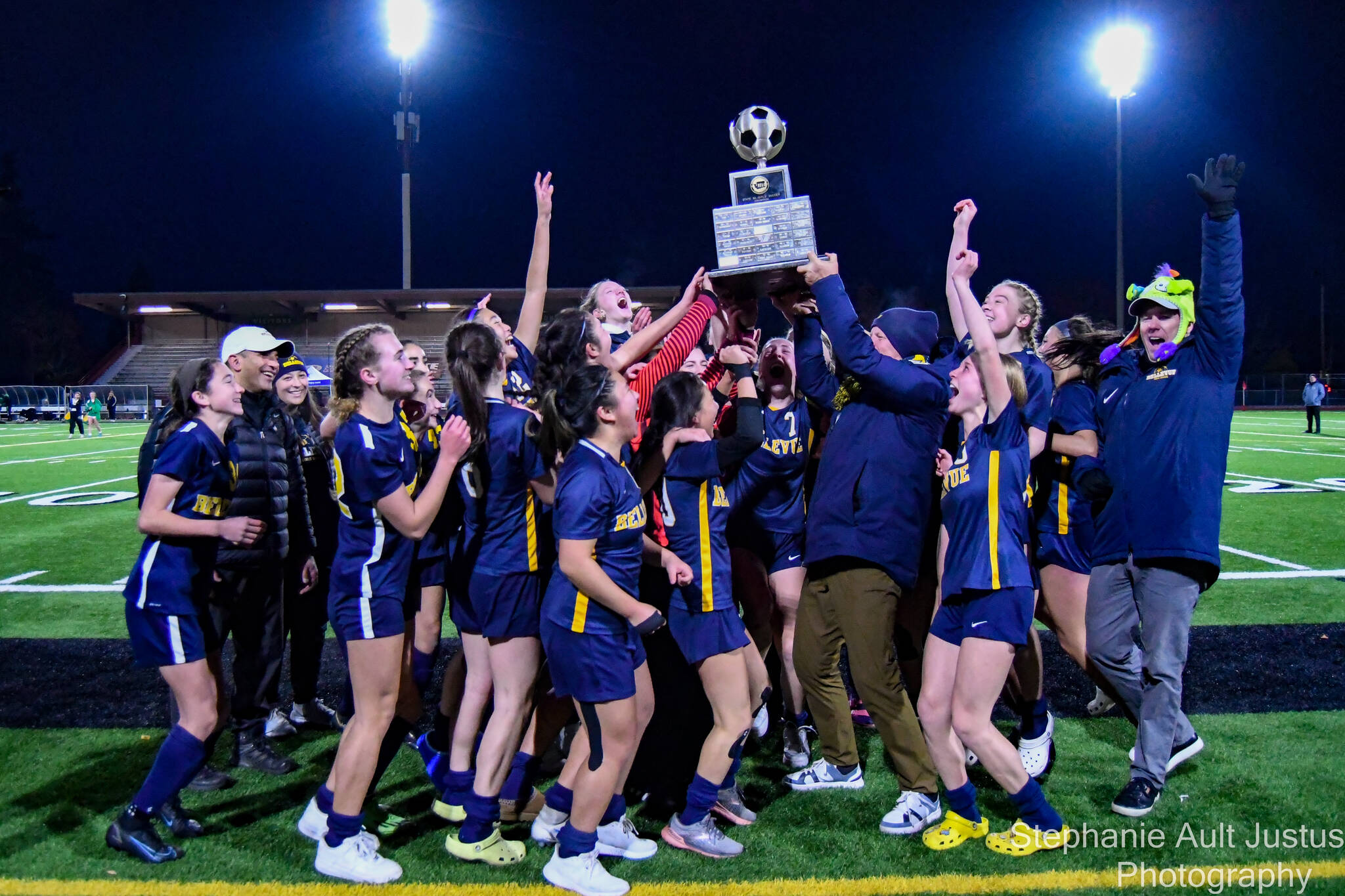 The Bellevue High School girls varsity soccer team holds up the 3A State Championship trophy. Courtesy of Stephanie Ault Justus.