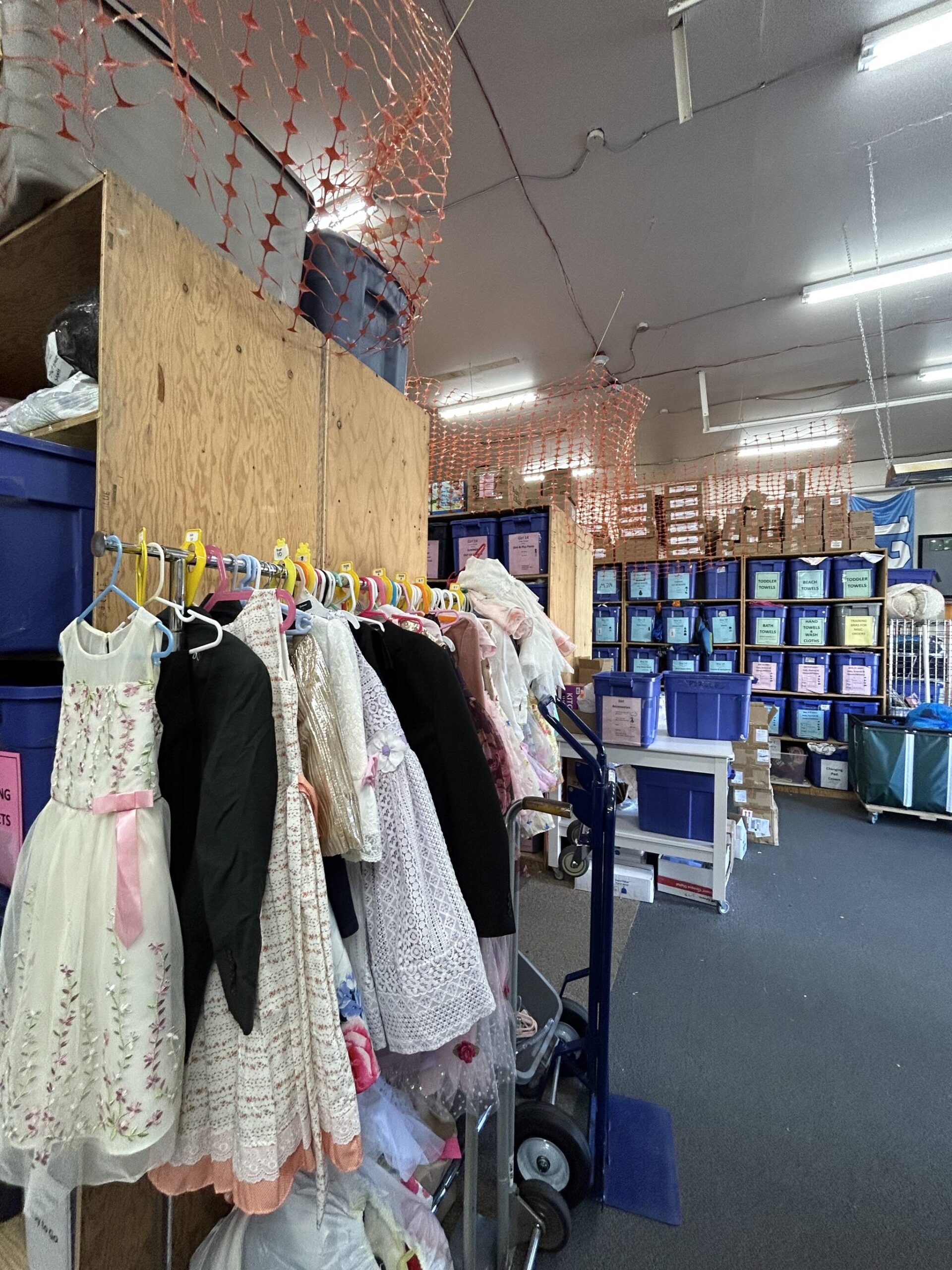 When partner agencies pick up the bundles, they can stop and shop at this rack with formal clothing if they know a child is going to an event. (Photo by Cameron Sires)