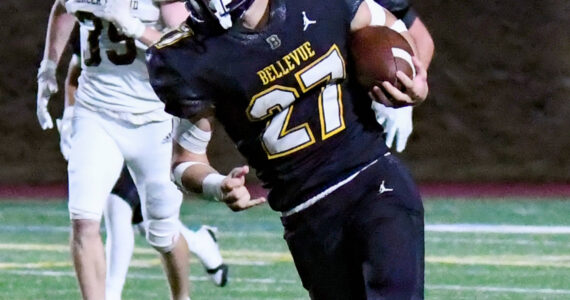 Bellevue senior #27 Blake Teets, who ran for a touchdown in this picture. Photo Credit: Stephanie Ault Justus