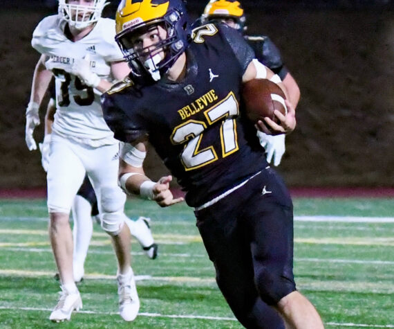 Bellevue senior #27 Blake Teets, who ran for a touchdown in this picture. Photo Credit: Stephanie Ault Justus