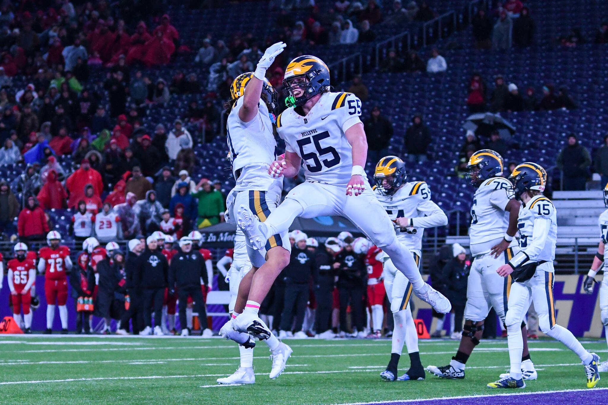 Bellevue’s Max Jones, left, and Ollie Sharp celebrate the Wolverines’ first touchdown. Photo courtesy of Stephanie Ault Justus