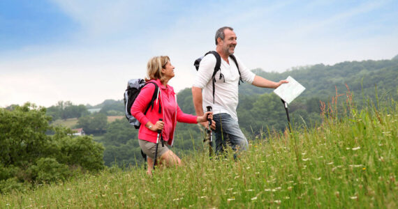 Senior couple hiking in natural landscape