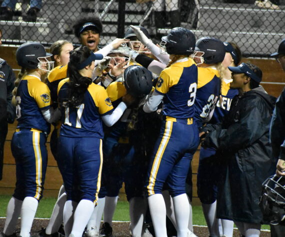 Bellevue celebrates a grand slam in the fifth inning. Ben Ray / The Reporter