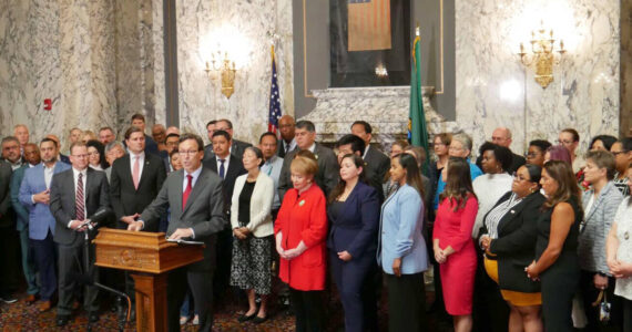 Gov. Bob Ferguson makes remarks during a press conference at the state Capitol in Olympia, on Aug. 19, responding to a letter he received the previous week from U.S. Attorney General Pam Bondi, threatening to withhold federal funding if the state does not change its approach cooperating on federal immigration enforcement. (Photo by Bill Lucia/Washington State Standard)