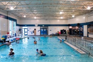 People enjoy the warm-water pool at the Bellevue Aquatic Center near Odle Middle School in Bellevue on Wednesday.