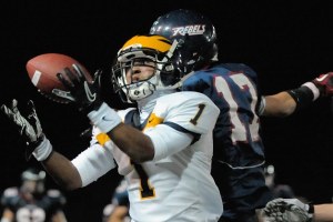 Wolverine DB Tyler Hasty (1) makes an interception late in the fourth quarter to seal a 21-14 Bellevue victory at Juanita on Friday.