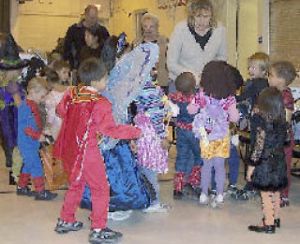 Kids in their Halloween costumes anxiously await the announcement by a teacher that the games are beginning at the Lake Heights Family YMCA annual Fall Family Festival. About 200 YMCA participants and their families gathered Friday