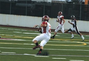 Newport quarterback Ross Quarre cuts upfield in the Knights win against Mercer Island.