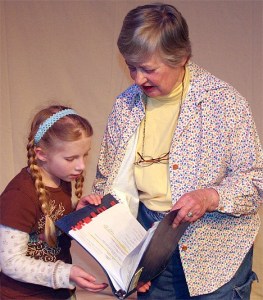 Pat Long rehearses with one of the children in the Bellevue Youth Theatre.