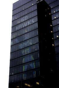 Expedia is showing its Seahawks pride in Bellevue with an image depicting Richard Sherman's game-winning tip to pass during the NFC Championship across its office tower.