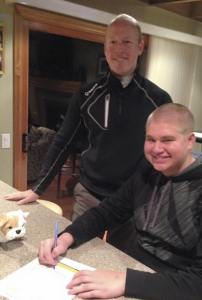 Newport Knights senior golfer Dom Marrese signed a letter of intent to play golf for Bellevue College on Feb. 3 in Bellevue. The Bellevue College men’s golf team is coached by Bryan Stevens (pictured).