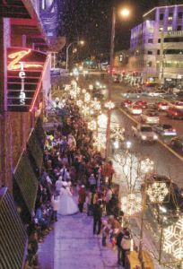 Lights sparkle along the sidewalks of Bellevue Way and Northeast Eighth during Snowflake Lane