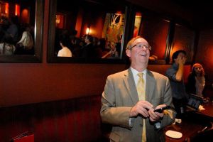 Bellevue City Council member John Chelminiak enjoys a happy moment as election returns Tuesday night gave him a commanding lead over his opponent.