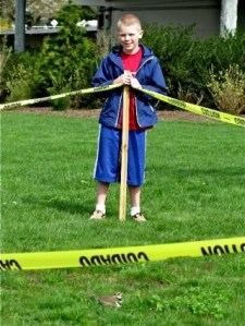 Sam Stone of Bellevue placed caution tape around the perimeter of a birds nest at Surrey Downs Park to protect the eggs until they hatch.