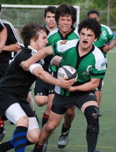 Sammamish freshman flanker Tomas Narvaja power through the Shelton defense for the Eastside Lions. Newport Senior and Lions captain Gen Kukasabe gives Narvaja support.