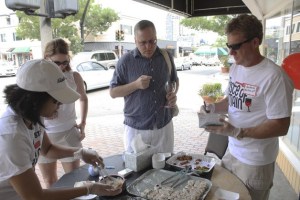 Glenn Schmidt hands out sushi and desserts at Ginza in Old Bellevue