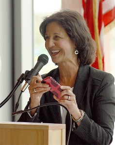 Retiring Bellevue Police Chief Linda Pillo turns off her cellphone as her last act of business during a retirement party Tuesday at City Hall.