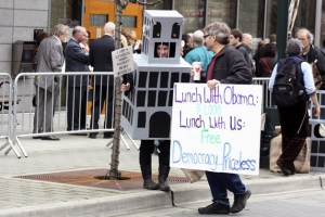 Protestors demonstrated while donors waited to enter the Westin for President Barack Obama's fundraiser.