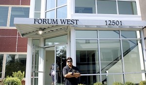 Temple Director Nanda Suta stands outside the Forum West building on Bel Red Road