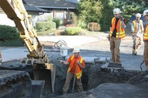 A city of Bellevue Water Department crew begins repair of a broken water main in the Somerset Woods neighborhood Monday