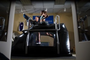 Letiwe Patton runs in the AlterG treadmill as Neil Chasan