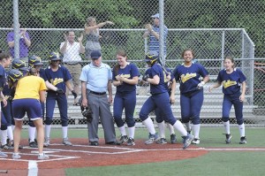 Bellevue players and coaches had plenty to celebrate after Kristie Bennett delivered a walk off home run in the first game at the KingCo tournament