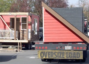 The former Knotty Bodies espresso stand in the Crossroads area is dismantled Thursday afternoon in preparation for its move from its location near Crossroads Park. The stand