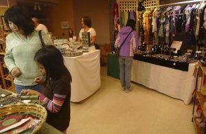 Vendor Sue Schleer offers samples of her homemade truffles at last week's Hilltop Holiday craft show. She was joined by 80 other vendors selling knit scarves