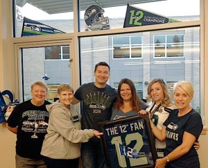 Staff members at Chinook Middle School show their spirit of the 12s on a Blue Friday at the school. Send us your best photos of 12th Man pride