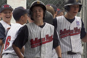 Bellevue West players celebrate one of Trevor Neely's (center) two home runs. Eastlake came back to win 9-8 in the bottom half of the sixth and final inning to take the tournament title.