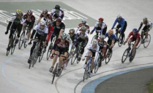 Cyclists race around the banked oval track at the Group Health Velodrome at Marymoor Park.