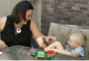 Felicia Otness shares a laugh with her son