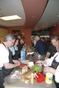 Celebrity chefs work on their dishes.