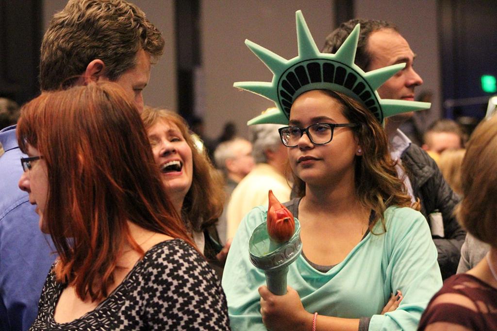 An attendee at the state democrats election night party dressed as Lady Liberty looks displeased as the national election results pour in (Allison DeAngelis/staff photo).