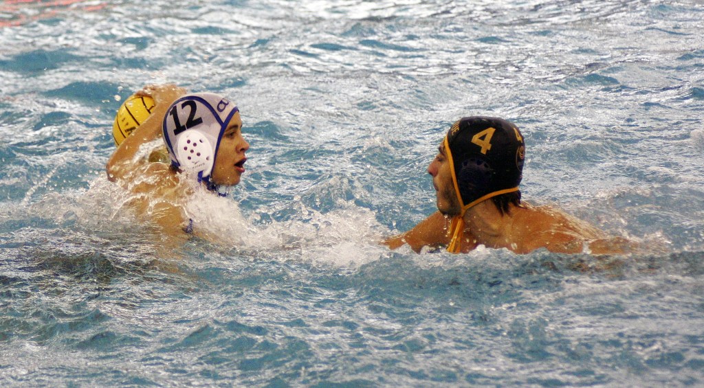 Bellevue senior Mario Abdel Shahed, right, puts pressure on Curtis sophomore Jorge Melendez, right, during the state championship game. Curtis defeated Bellevue 11-6 on Nov. 12 at the Curtis Aquatic Center in University Place.                                 Photo courtesy of Bob Averill