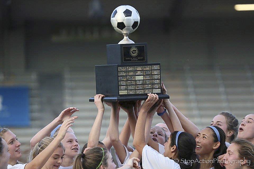 Photo courtesy of Don Borin/Stop Action Photography                                The Bellevue Wolverines hoist the Class 3A state championship trophy following their 1-0 victory against Southridge in the Class 3A state championship game on Nov. 19 at Sparks Stadium in Puyallup.
