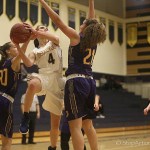 Bellevue Wolverines junior Annika Prins, left, attacks the basket while being defended by Issaquah Eagles player Mariah Van Halm, right, in a non-league matchup on Nov. 30 at Bellevue High School. The Wolverines defeated the Eagles 79-59.                                Photo courtesy of Don Borin/Stop Action Photography