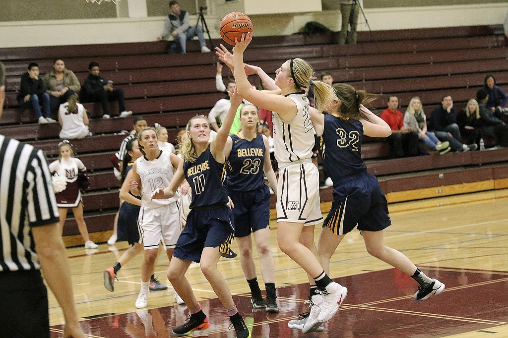 Photo courtesy of Willy Paine                                Mercer Island&rsquo;s Anna Luce, center, unleashes a perimeter shot while Bellevue&rsquo;s Kathryn Roberts, left, plays formidable defense on Dec. 12 at Mercer Island High School. The Islanders defeated the Wolverines 67-44.