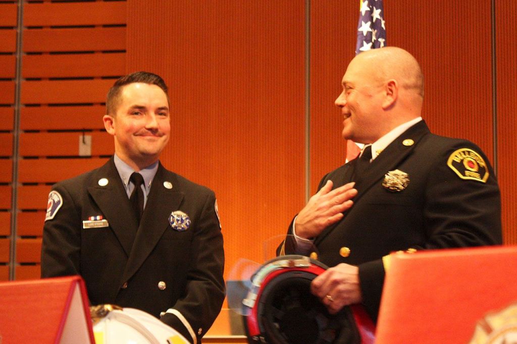 Deputy Chief Todd Dickerboom, right, congratulates newly promoted Lieutenant Luke Steere, left (Allison DeAngelis/staff photo).