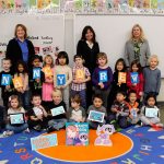 The Bellevue Chamber of Commerce and HeR Interactive, a Bellevue-based award-winning game publisher and developer, have partnered to bring the gift of coding to 800 Bellevue School District preschoolers. Contributed photo                                Students from Jing Mei Elementary School in Bellevue with Penny Milliken, CEO, HeR Interactive; Eva Collins, deputy superintendent, Bellevue School District; and Betty Capestany, president and CEO, Bellevue Chamber of Commerce. Contributed photo